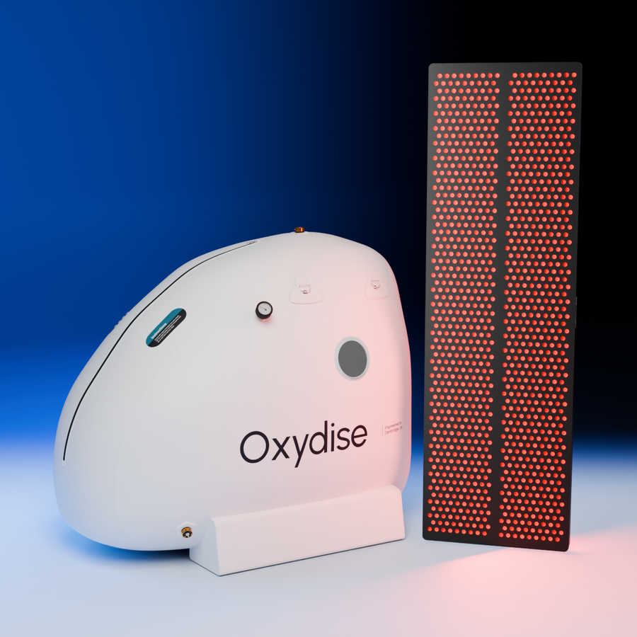 Hyperbaric Oxygen sitting chamber and Red Light Therapy panel in the blue studio