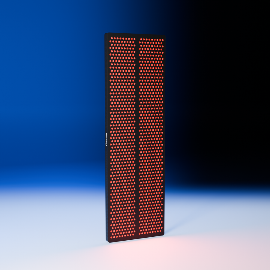 Oxydise Red Light Therapy panel standing upright in the blue studio