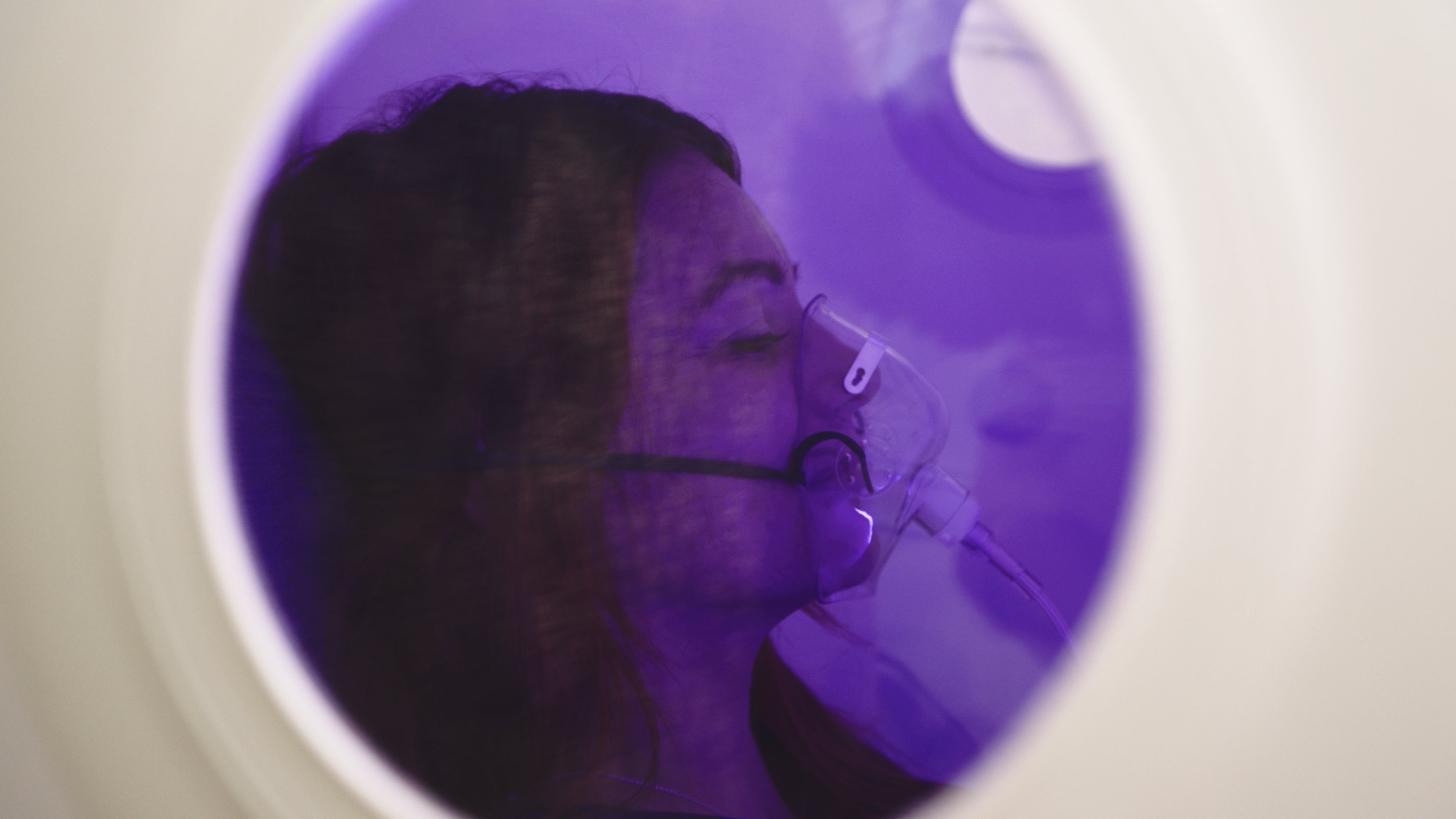 Dianne settled inside the chamber wearing her oxygen mask
