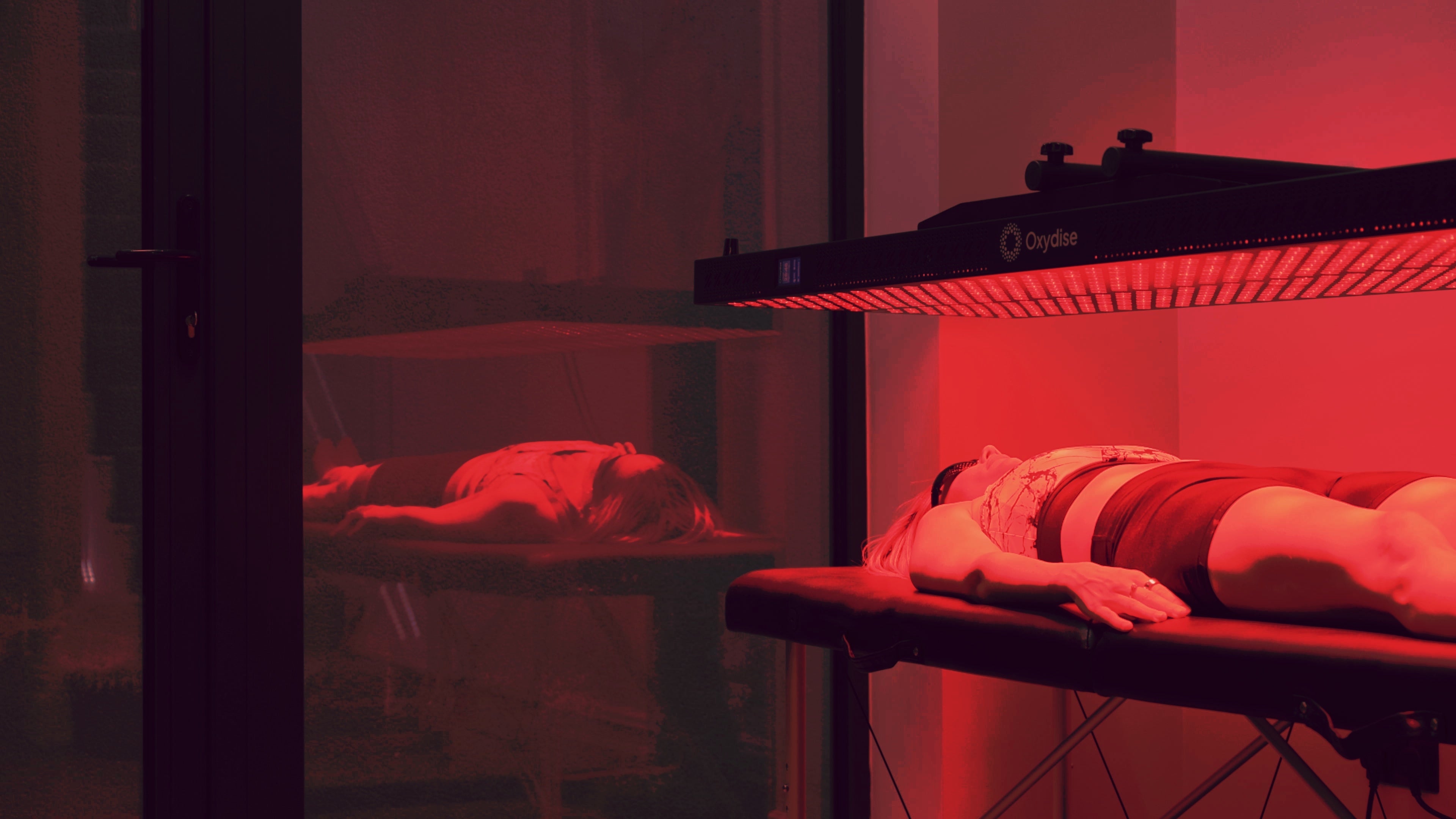 Dianne lying beneath the Red Light panel