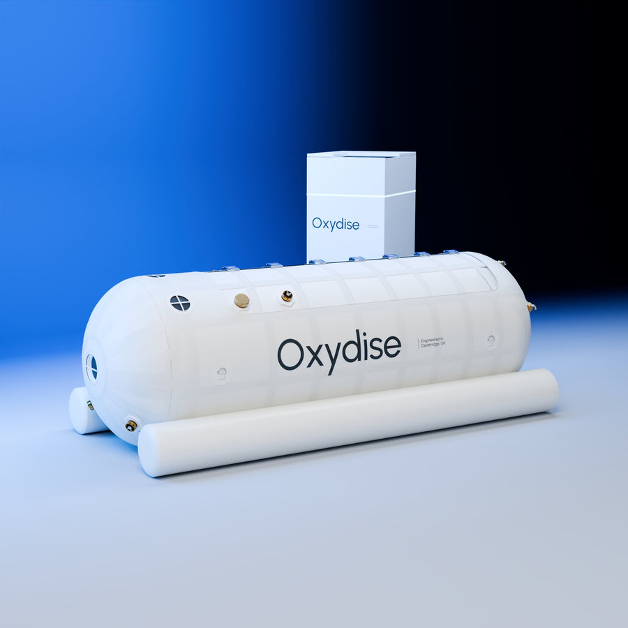 Oxydise High-Pressure Soft-shell Lying Chamber with equipment, viewed from a low three-quarter angle.