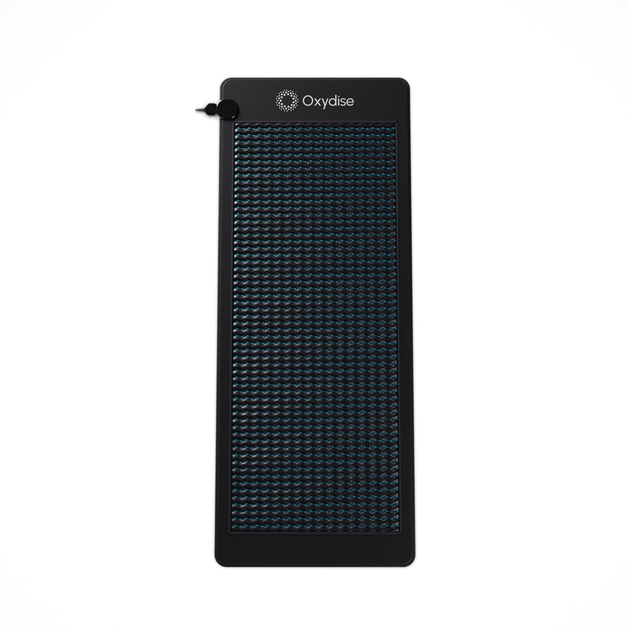 Oxydise Infrared PEMF Mat on white, top view, with the white embroidered Oxydise logo