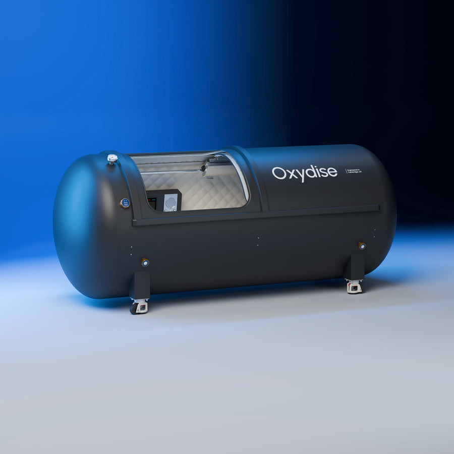 Oxydise Lying Hardshell Chamber from a low three-quarter angle in the blue studio.