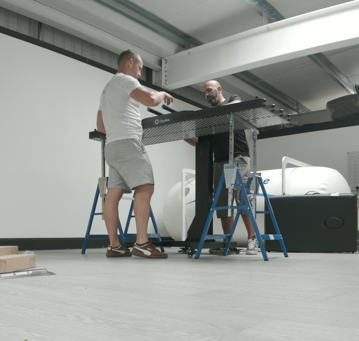 Oxydise installers fitting a Red Light panel during the Moses Itauma installation